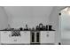Modern bar area with wine rack and beverage cooler at 8525 Saint Marlo Fairway Drive, Duluth, GA 30097