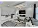 A contemporary bedroom sitting area with a bar, fireplace, and stylish decor at 8525 Saint Marlo Fairway Drive, Duluth, GA 30097