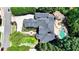 Magnificent home with a sprawling pool, spa, outdoor seating, and meticulous landscaping at 8525 Saint Marlo Fairway Way, Duluth, GA 30097