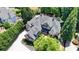 Spacious brick estate featuring a backyard pool oasis and lush, private landscaping at 8525 Saint Marlo Fairway Way, Duluth, GA 30097