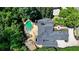 Stunning aerial view showcasing a custom home with a pool and lush landscaping at 8525 Saint Marlo Fairway Way, Duluth, GA 30097