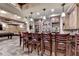 Finished basement featuring a custom bar area with elegant lighting and stone accents at 8525 Saint Marlo Fairway Way, Duluth, GA 30097