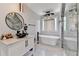 A luxurious bathroom featuring a frameless glass shower, soaking tub, modern vanity and fixtures, plus designer tile throughout at 8525 Saint Marlo Fairway Way, Duluth, GA 30097
