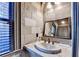 Cozy bathroom with stone walls and vanity at 8525 Saint Marlo Fairway Way, Duluth, GA 30097