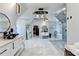 A spacious bathroom featuring a frameless glass shower, soaking tub, modern vanity and fixtures, and designer tile throughout at 8525 Saint Marlo Fairway Way, Duluth, GA 30097