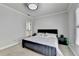 Bedroom featuring a comfortable bed, stylish bedside tables, and bright natural light at 8525 Saint Marlo Fairway Way, Duluth, GA 30097