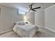 Cozy bedroom featuring a ceiling fan, neutral color scheme, and carpet floors at 8525 Saint Marlo Fairway Way, Duluth, GA 30097