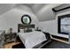 Bedroom featuring a round window, and wood flooring at 8525 Saint Marlo Fairway Way, Duluth, GA 30097