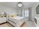 Cozy bedroom featuring a plush bed, white furniture, and bright natural lighting at 8525 Saint Marlo Fairway Way, Duluth, GA 30097