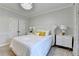 Inviting bedroom featuring a soft bed, matching bedside tables, and stylish lamps at 8525 Saint Marlo Fairway Way, Duluth, GA 30097