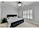 Bedroom featuring a comfortable bed, stylish bedside tables, and bright natural light at 8525 Saint Marlo Fairway Way, Duluth, GA 30097