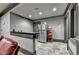 Home theater concession area featuring a stainless steel refrigerator, countertop, and popcorn machine, offering convenience and style at 8525 Saint Marlo Fairway Way, Duluth, GA 30097
