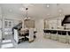 Dining area open to kitchen and with chandelier lighting at 8525 Saint Marlo Fairway Way, Duluth, GA 30097