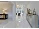 Spacious foyer with elegant chandelier, console, and bright, welcoming atmosphere for guests at 8525 Saint Marlo Fairway Way, Duluth, GA 30097