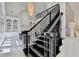 Staircase and entrance hall with elegant chandelier at 8525 Saint Marlo Fairway Way, Duluth, GA 30097