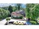 Beautiful brick home with a landscaped front yard, circular driveway, and inviting curb appeal at 8525 Saint Marlo Fairway Way, Duluth, GA 30097