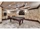 Basement game room featuring a pool table, decorative ceiling, stone-like walls, and recessed lighting at 8525 Saint Marlo Fairway Way, Duluth, GA 30097