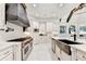 Well-equipped kitchen featuring a large island and custom cabinets at 8525 Saint Marlo Fairway Way, Duluth, GA 30097