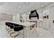Bright, open kitchen with marble island, stainless steel appliances, and sleek design at 8525 Saint Marlo Fairway Way, Duluth, GA 30097