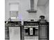 Kitchen featuring stainless steel appliances, modern sink, granite countertop, and a window for natural light at 8525 Saint Marlo Fairway Way, Duluth, GA 30097