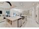 Expansive kitchen island with marble countertop and stainless steel sink for prep and entertaining at 8525 Saint Marlo Fairway Way, Duluth, GA 30097
