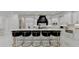 Spacious kitchen features white cabinets, a large island with seating, and high-end finishes at 8525 Saint Marlo Fairway Way, Duluth, GA 30097