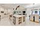 Elegant kitchen with large island, stainless steel appliances, and dining area at 8525 Saint Marlo Fairway Way, Duluth, GA 30097