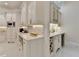 Butler's pantry with wine cooler and bar seating at 8525 Saint Marlo Fairway Way, Duluth, GA 30097