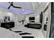 Open concept space featuring a modern living room with fireplace adjacent to the main bedroom with a connecting bar area at 8525 Saint Marlo Fairway Way, Duluth, GA 30097