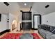 A comfortable living room with a wet bar and a staircase at 8525 Saint Marlo Fairway Way, Duluth, GA 30097