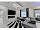 Spacious living room with a fireplace, sleek furniture, and stylish design, providing a welcoming atmosphere for gatherings at 8525 Saint Marlo Fairway Way, Duluth, GA 30097