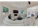 Bright living room features stone fireplace and is open to the kitchen at 8525 Saint Marlo Fairway Way, Duluth, GA 30097