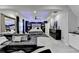 Expansive open concept living room seamlessly integrating stylish living, entertainment, and sleeping spaces for ultimate convenience at 8525 Saint Marlo Fairway Way, Duluth, GA 30097