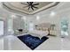 Spacious main bedroom features a tray ceiling, marble fireplace, sitting area, and large windows at 8525 Saint Marlo Fairway Way, Duluth, GA 30097