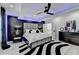 Main bedroom showcasing tray ceilings, stylish furniture and decor, and a glimpse into the spacious walk in closet at 8525 Saint Marlo Fairway Way, Duluth, GA 30097