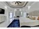 This is a spacious main bedroom with a seating area and a large television in the background at 8525 Saint Marlo Fairway Way, Duluth, GA 30097