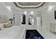 Spacious main bedroom features a tray ceiling, a mirror, access to the bathroom, and large windows at 8525 Saint Marlo Fairway Way, Duluth, GA 30097