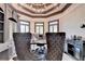 Modern home office with custom built-ins, sleek gray decor, and ample natural light at 8525 Saint Marlo Fairway Way, Duluth, GA 30097