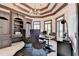 Stylish home office with built-in cabinetry, sleek desk, and modern decor for productivity at 8525 Saint Marlo Fairway Way, Duluth, GA 30097