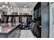 A luxurious walk-in closet with custom shelves and cabinets for ample storage at 8525 Saint Marlo Fairway Way, Duluth, GA 30097