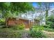 Spacious backyard with a screened-in porch and brick patio, ideal for outdoor entertaining at 890 Oriole Se Ln, Marietta, GA 30067