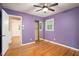 Comfortable bedroom with hardwood floors, a ceiling fan, and a mirrored closet at 890 Oriole Se Ln, Marietta, GA 30067