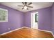 Bedroom with hardwood floors, ceiling fan, window and en suite bathroom at 890 Oriole Se Ln, Marietta, GA 30067