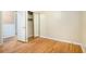 Bright bedroom featuring gleaming hardwood floors, a closet and neutral walls, ready for your personal touch at 890 Oriole Se Ln, Marietta, GA 30067