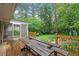 Relaxing wooden deck featuring outdoor seating, perfect for enjoying the serene backyard at 890 Oriole Se Ln, Marietta, GA 30067