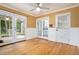 Bright dining room with hardwood floors, crown molding, and french doors leading to a screened-in porch at 890 Oriole Se Ln, Marietta, GA 30067