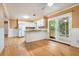 Bright kitchen with white cabinets, granite countertops, and access to the screened porch at 890 Oriole Se Ln, Marietta, GA 30067