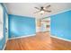 Light blue living room with hardwood floors that flows into the kitchen at 890 Oriole Se Ln, Marietta, GA 30067