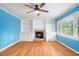 Spacious living room featuring a fireplace, built-in shelves, and hardwood floors at 890 Oriole Se Ln, Marietta, GA 30067
