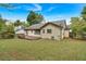 Well-maintained backyard features a deck, lush lawn, and mature trees for outdoor enjoyment at 3035 Landington Way, Duluth, GA 30096